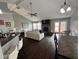 The living room showcases a brick fireplace and a vaulted ceiling, enhancing the home's cozy and inviting atmosphere at 676 Sunblest Blvd, Fishers, IN 46038