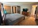 Comfortable main bedroom with neutral tones, closet space, and adjacent bathroom entry, offering a private retreat at 676 Sunblest Blvd, Fishers, IN 46038
