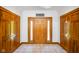 Welcoming foyer featuring a beautiful front door, tile flooring, and ample closet space at 6780 E Woodland Ct, Mooresville, IN 46158