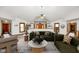 Comfortable living room with high ceilings, stylish furnishings, and natural light at 6780 E Woodland Ct, Mooresville, IN 46158