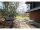 Scenic backyard showcasing an outbuilding next to the home, connected by a path at 701 E Main St, Westfield, IN 46074
