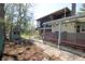 Backyard features include storage shed, pond, mature trees, covered porch, and greenery at 701 E Main St, Westfield, IN 46074