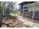 Backyard features a small pond, storage shed, covered porch, mature trees, and walkway at 701 E Main St, Westfield, IN 46074