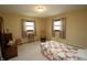 Comfortable bedroom with neutral tones, highlighting natural light from the large windows at 701 E Main St, Westfield, IN 46074