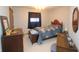 Well-lit bedroom with dark curtains, matching wood furniture, and bright window at 701 E Main St, Westfield, IN 46074