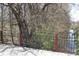 View of a bridge over creek lined with lush trees and greenery at 701 E Main St, Westfield, IN 46074