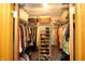 Organized walk-in closet featuring shelving, hanging racks and storage baskets at 701 E Main St, Westfield, IN 46074