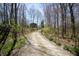 Long driveway leading to a home, surrounded by woods at 701 E Main St, Westfield, IN 46074
