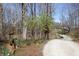 Gravel driveway winds through a wooded property at 701 E Main St, Westfield, IN 46074