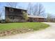 Beautiful combination brick and cedar home with spacious front lawn and driveway at 701 E Main St, Westfield, IN 46074