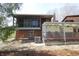 Backyard view featuring screened in porch and spacious patio area, perfect for outdoor enjoyment at 701 E Main St, Westfield, IN 46074
