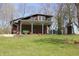 Two-story home with brick siding and a white-columned porch at 701 E Main St, Westfield, IN 46074