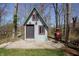 Charming backyard building with a unique terracotta chimney and whimsical architectural design at 701 E Main St, Westfield, IN 46074