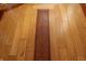 Detailed hardwood flooring with custom inlay and unique design elements create a warm, inviting space at 701 E Main St, Westfield, IN 46074