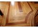 Custom hardwood flooring with inlay and unique design elements create a visually appealing space at 701 E Main St, Westfield, IN 46074