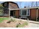 Charming home featuring a brick facade, bay window, and meticulously landscaped front yard at 701 E Main St, Westfield, IN 46074