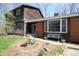 Charming home showcasing a landscaped front yard, with a brick and wood exterior at 701 E Main St, Westfield, IN 46074