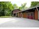 Exterior view of a well-maintained home featuring an attached garage, and spacious gravel driveway at 701 E Main St, Westfield, IN 46074