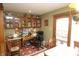 Charming home office featuring built-in cabinets, desk, and an ergonomic black chair at 701 E Main St, Westfield, IN 46074
