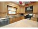 Bright eat-in kitchen with natural wood cabinets and stainless steel appliances at 701 E Main St, Westfield, IN 46074