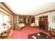 Living room with bay window, fireplace, hardwood trim, classic furniture, and decor at 701 E Main St, Westfield, IN 46074