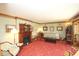 Cozy living room showcasing an antique fireplace, classic furniture, and hardwood trim at 701 E Main St, Westfield, IN 46074