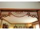 Ornate wood design elements above entry opening, adding character and charm to this vintage home at 701 E Main St, Westfield, IN 46074