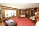 Living room with hardwood trim, fireplace, classic furniture, and plenty of natural light at 701 E Main St, Westfield, IN 46074