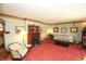 Charming living room with ornate fireplace, classic furniture, and a traditional rug at 701 E Main St, Westfield, IN 46074