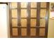 Elegant dark wood pantry with decorative copper inlays and spacious storage at 701 E Main St, Westfield, IN 46074