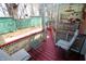 Inviting covered patio with comfortable seating and a view of the landscaped yard at 701 E Main St, Westfield, IN 46074