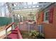 Covered porch and lattice railings offer a relaxing outdoor retreat with seating at 701 E Main St, Westfield, IN 46074