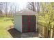 Small outdoor shed with double doors and a stone paver walkway at 701 E Main St, Westfield, IN 46074