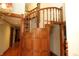 A wooden staircase provides a classic look while leading to other floors of the home at 701 E Main St, Westfield, IN 46074