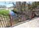 Peaceful stream flows alongside a fence at 701 E Main St, Westfield, IN 46074