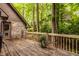 Charming outdoor back deck with wooden railing and wooded views provides a private retreat at 7249 Tuliptree Trl, Indianapolis, IN 46256
