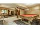 Finished basement area with pool table, carpet and a window at 7249 Tuliptree Trl, Indianapolis, IN 46256