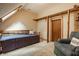 Bedroom with blue bed, carpet and a closet with no door at 7249 Tuliptree Trl, Indianapolis, IN 46256