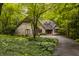 Charming brick home with mature trees, landscaping, and a circular driveway at 7249 Tuliptree Trl, Indianapolis, IN 46256