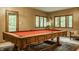 Game room with view of backyard, windows, and a pool table at 7249 Tuliptree Trl, Indianapolis, IN 46256