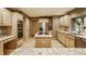 Spacious kitchen featuring an island, stainless steel appliances, and light wood cabinetry at 7249 Tuliptree Trl, Indianapolis, IN 46256