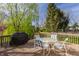 Back deck featuring a dining table and BBQ, ideal for outdoor entertaining at 757 Howe Dr, Carmel, IN 46032