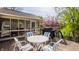 Back deck with table and chairs, BBQ, and screened in porch provides many outdoor options at 757 Howe Dr, Carmel, IN 46032