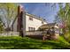 The backyard features a spacious deck, screened-in porch, and well-manicured lawn at 757 Howe Dr, Carmel, IN 46032