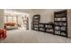 Bright and spacious living room, and bookshelves, providing a cozy and inviting area for relaxation and leisure activities at 757 Howe Dr, Carmel, IN 46032