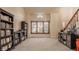 Cozy living room with ample natural light, a staircase leading to the upper level, and a serene view of the outdoors at 757 Howe Dr, Carmel, IN 46032