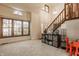 Inviting living room with large windows, a staircase, and comfortable seating arrangements, perfect for Gathering gatherings at 757 Howe Dr, Carmel, IN 46032