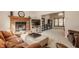 Bright living room featuring a brick fireplace, tv, and comfortable seating, with views to other rooms at 757 Howe Dr, Carmel, IN 46032