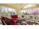 Relaxing screened porch with comfortable seating, great light, and beautiful backyard views at 757 Howe Dr, Carmel, IN 46032