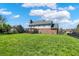 Picture of the expansive backyard showcasing a well-maintained lawn and deck with pergola at 7637 Sand Run Ct, Indianapolis, IN 46259
